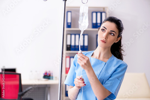 Young female doctor in infusion concept 