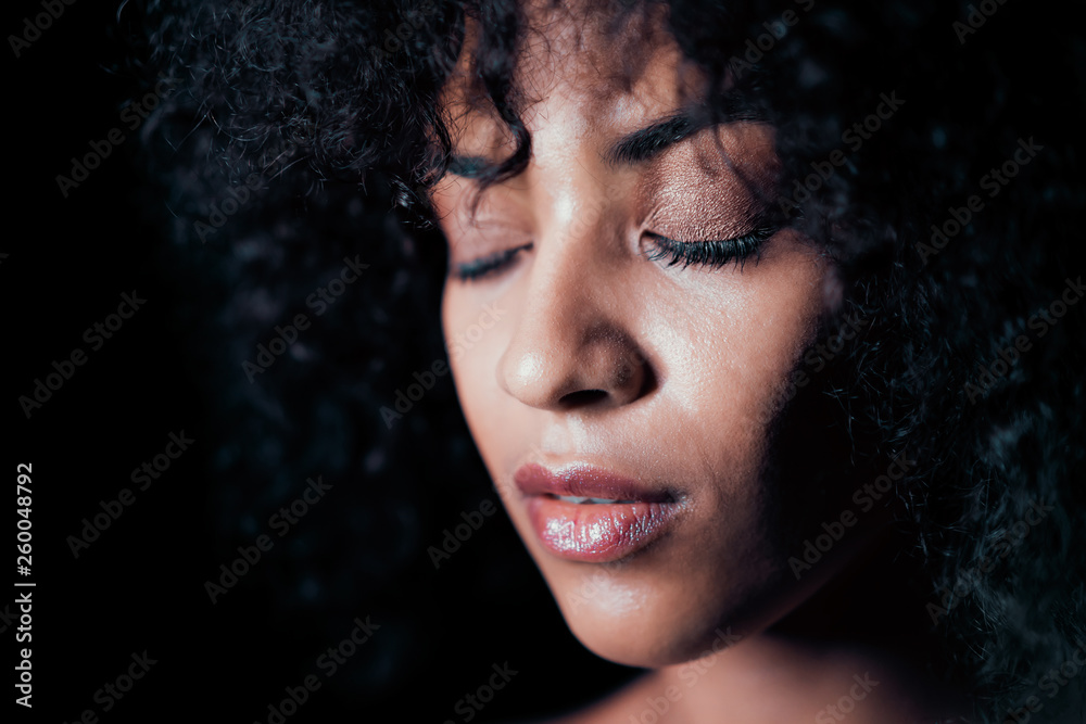 Portrait of afro girl. Tempting woman with perfect makeup and curly hairstyle smiling. Glamour, fashion, model, healthy skin concept. Copy space. Portrait of afro girl. Tempting woman with perfect makeup and curly hairstyle smiling. Glamour, fashion, model, healthy skin concept. Copy space.