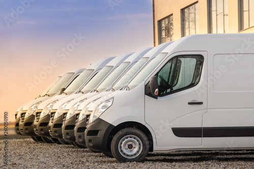 Billede på lærred commercial delivery vans parked in row