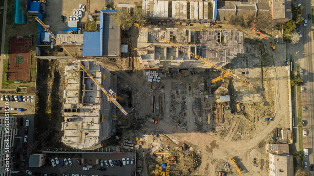 Top down view of Construction site with crane and building