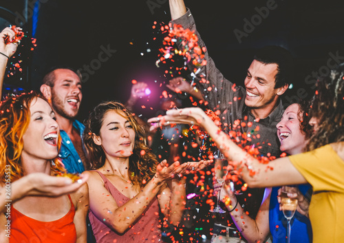 Sticker Happy friends doing party throwing confetti in the club - Millennial young peopl