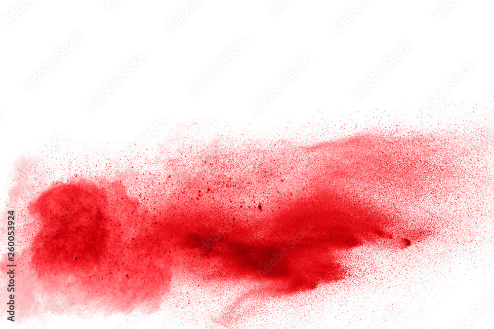 Explosion of red color powder on white background. Splashing of red color powder dust.