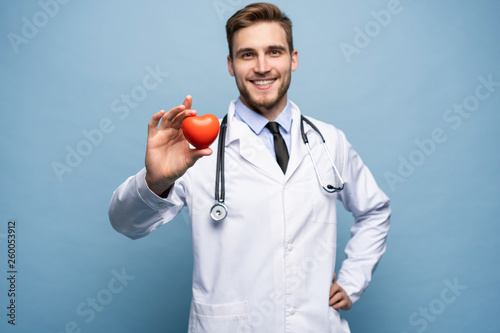 healthcare and medical concept - male doctor with heart.