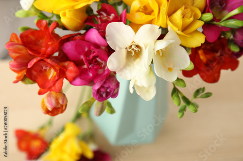 Fototapeta Naklejka Na Ścianę i Meble -  Beautiful spring freesia flowers on table, closeup