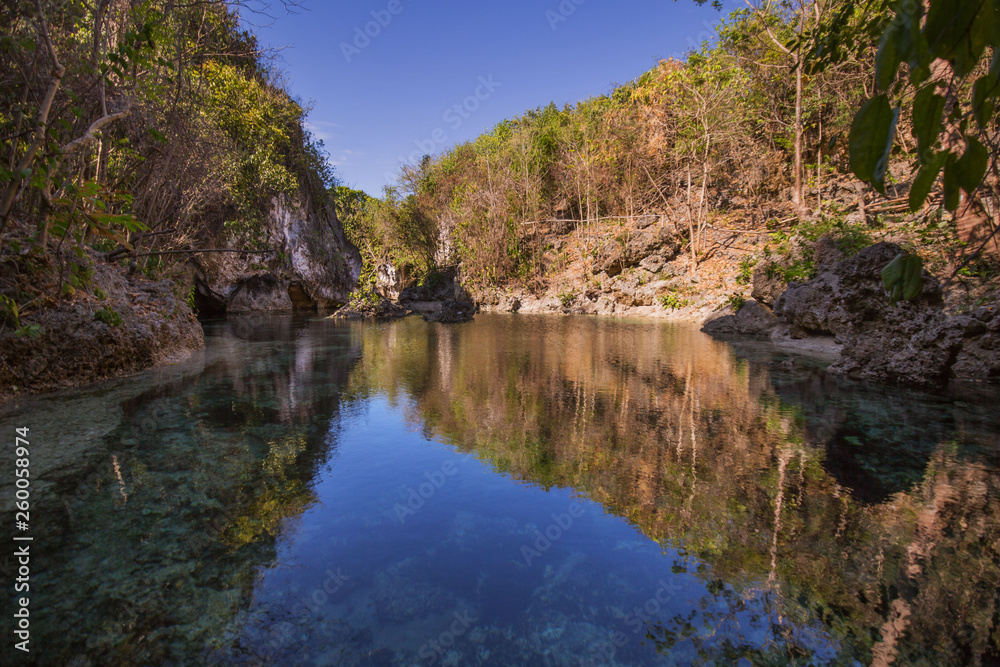 Lagoon sightseeing destination kinatarkan Island with crystal clear water and a rocky terrain  a  calm lagoon water at this viewpoint of kinatarkan