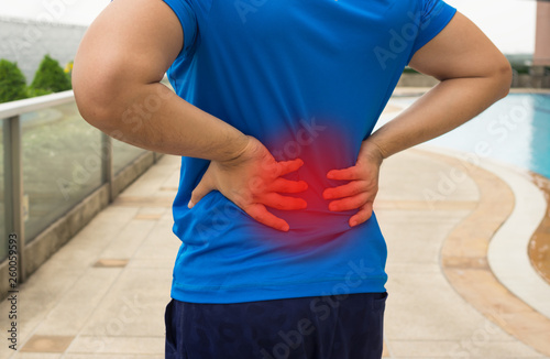 Male suffered with back pain from exercise.