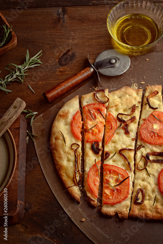 top view Sliced Focaccia With Onions Tomatoes and Rosemary
