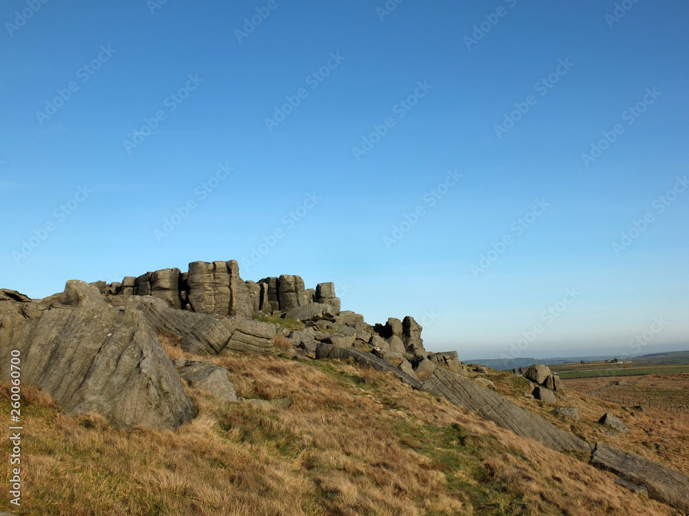 panoramic view of a large rugged gritstone outcrop at the bridestones a large rock formation in west yorkshire near todmorden