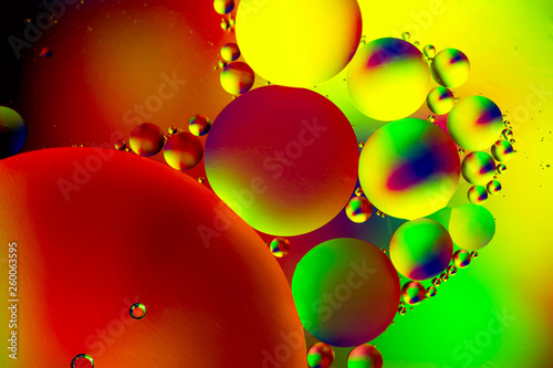 Abstract background with colorful gradient colors. Oil drops in water abstract psychedelic pattern image. Water bubbles abstract background.