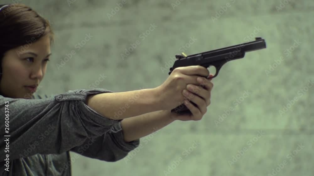 Slow Motion - Asian Girl Aiming Gun