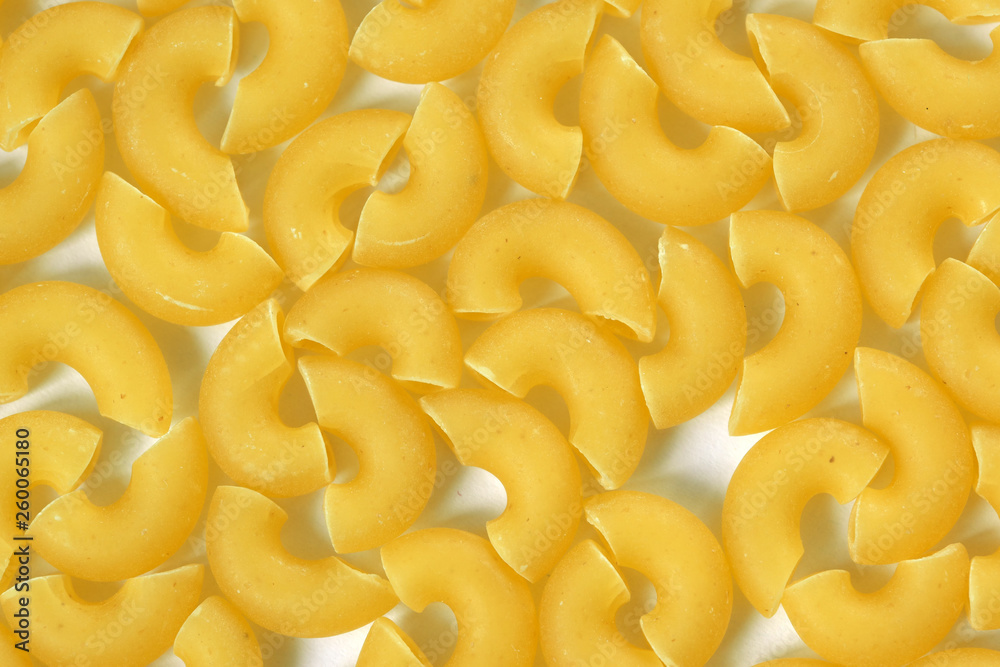 Raw wheat pasta close up Raw wheat pasta close up