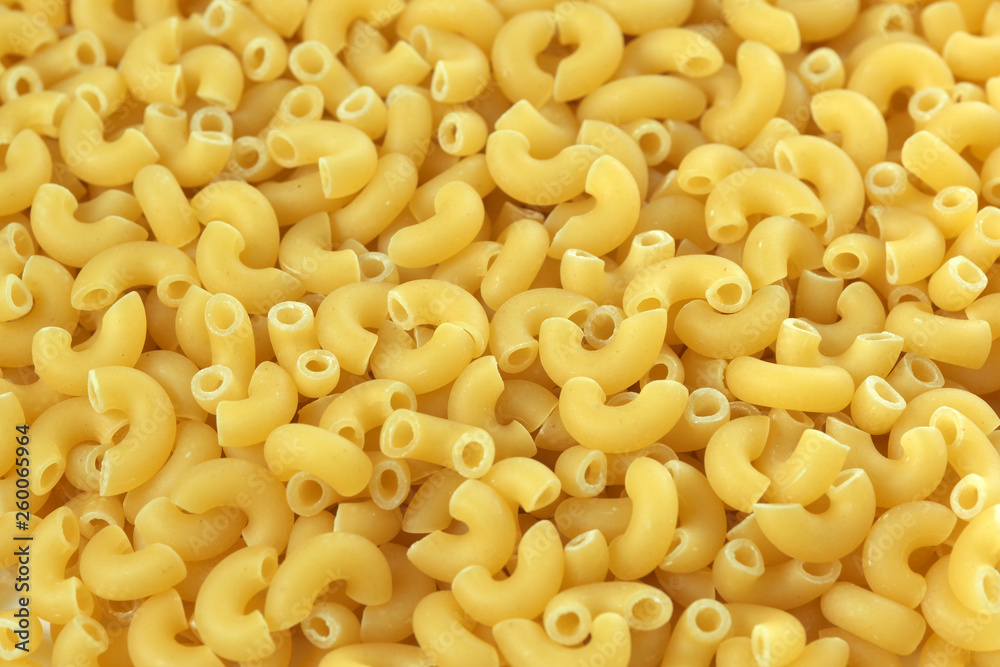 Raw wheat pasta close up Raw wheat pasta close up