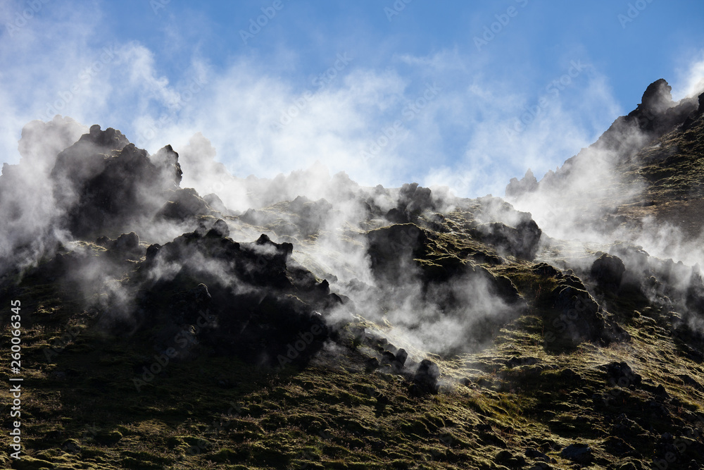 Iceland geothermal zone - area in mountains with hot springs. Cracks in mountains with hot steam.Tourist and natural attractions. Iceland geothermal zone - area in mountains with hot springs. Cracks in mountains with hot steam.Tourist and natural attractions.