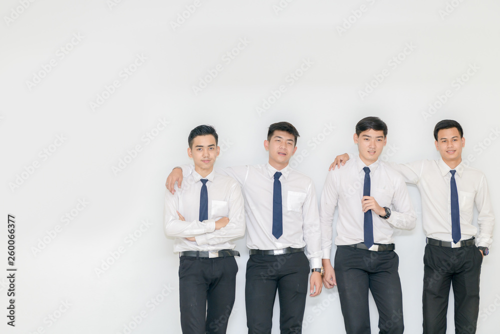 Smart young students standing together with copy space Smart young students standing together with copy space