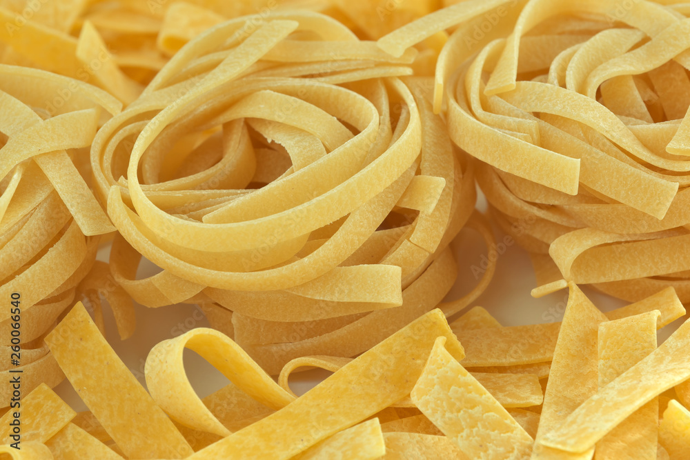 Raw wheat pasta close up Raw wheat pasta close up