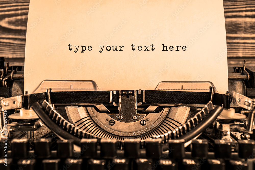 type your text here printed on a sheet of paper on a vintage