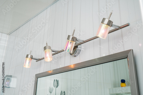  lighting fixtures in the bathroom over a mirror