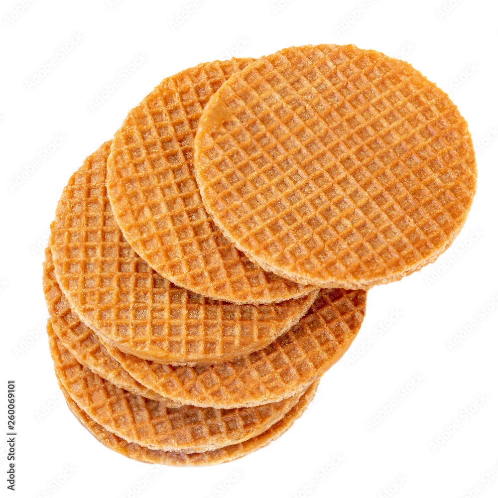 Pile of caramel round Dutch waffles isolated on white background. Top view Pile of caramel round Dutch waffles isolated on white background. Top view