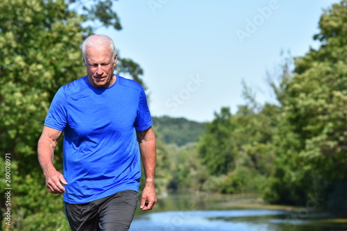 Male Senior Walking By River