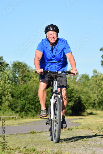 Athlete Retiree Male Cyclist Smiling Riding Bike