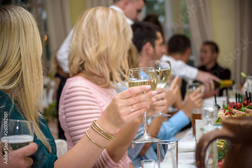 Celebration. People holding glasses of champagne making a toast