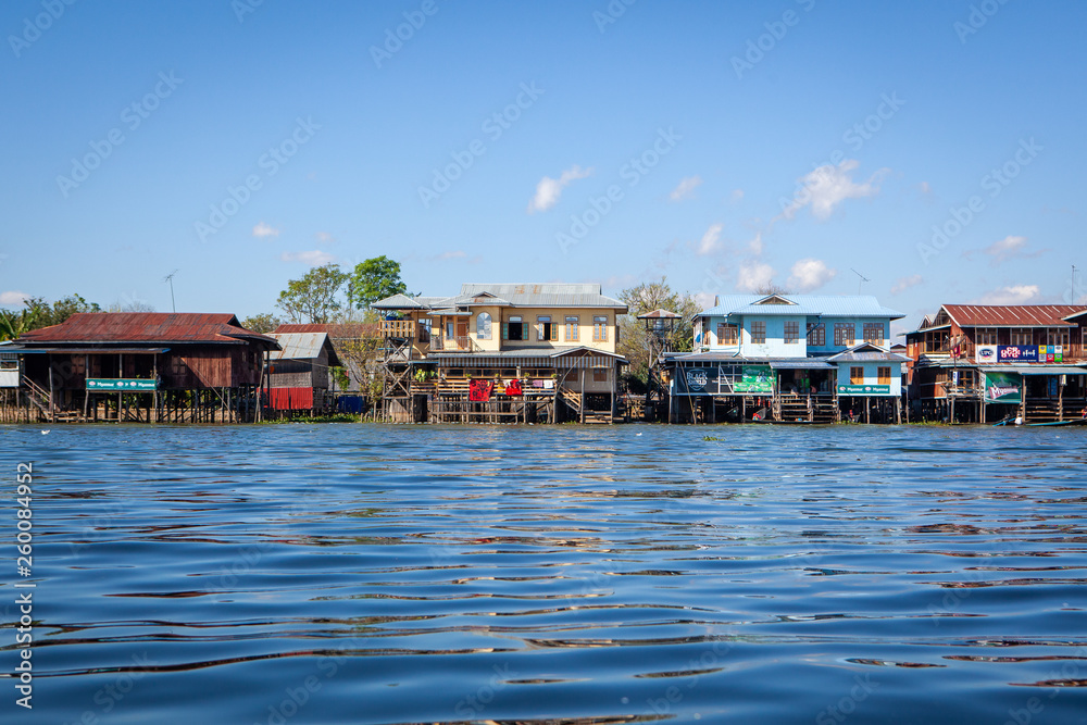 View to traditional floating village with houses built on piles at Inle lake, shan state, Myanmar.
