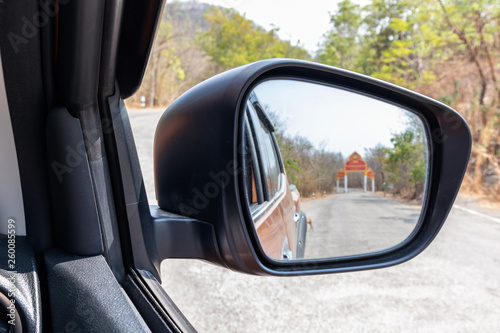 Side view mirror of pickup truck. © lllonajalll