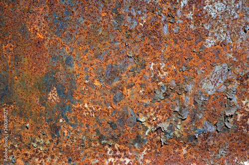 Old metal iron rust background and texture. Rusty metal wall covered with cracked paint