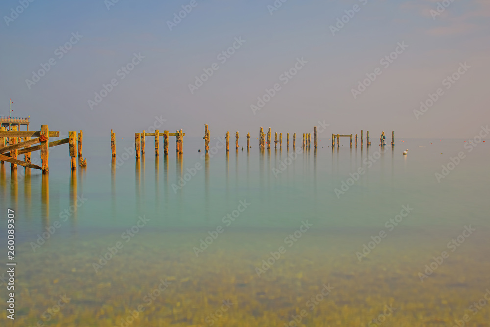 The still,calm waters at the old Swanage Pier