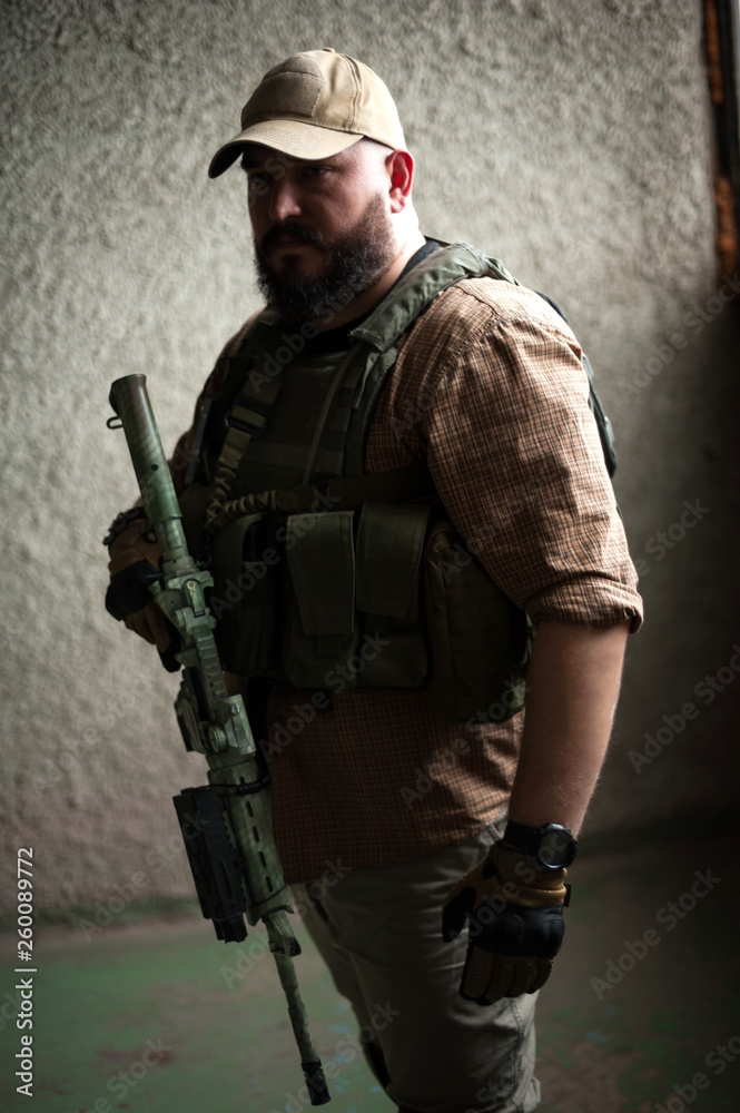 Armed soldier ready for battle. Military concept. Armed soldier ready for battle. Military concept.