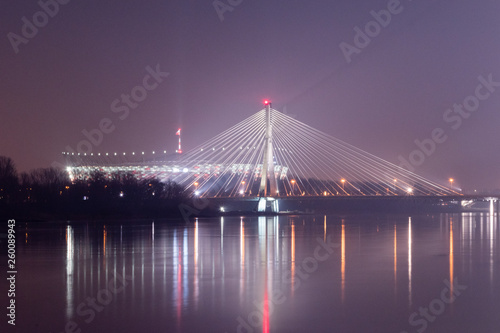 Swietokrzyski Bridge and the National Stadium at night in Warsaw, Poland.