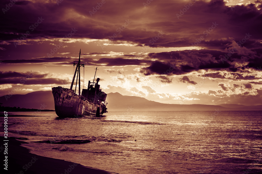 Rusty broken shipwreck on sea shore Rusty broken shipwreck on sea shore