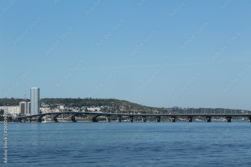 City panorama. Bridge over river at summer day