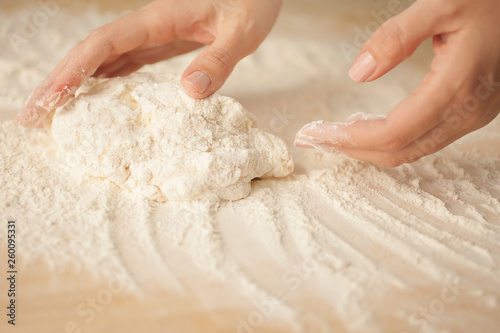 Making dough by female hands at home