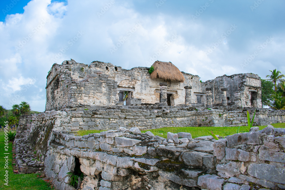 Old ancient Mayan Mexican ruins of City in Tulum, Mexico. Archaeological site, Sunny day with blue sky 