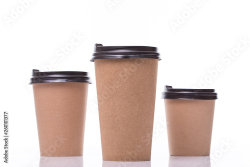 Three paper coffee cups isolated over white background. Clipping path