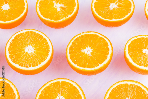 Background of oranges fruits. Many halves of fresh oranges  top view. Citrus for making juice. A lot of sliced oranges on a white background. Concept