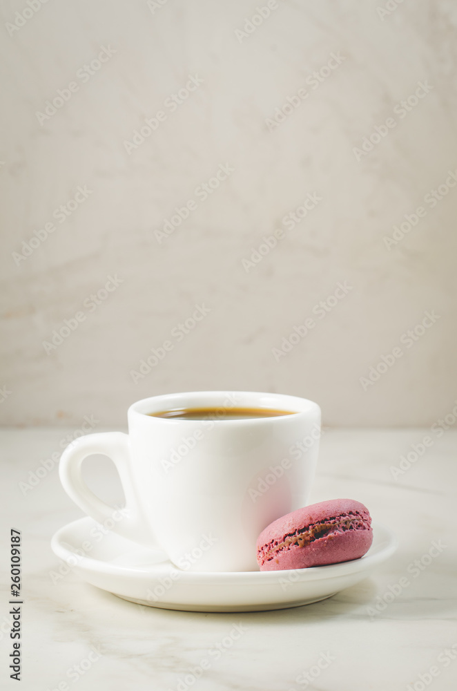 sweet macaroons or macaron and coffee cup on a white background, selective focus. French dessert sweet macaroons or macaron and coffee cup on a white background, selective focus. French dessert