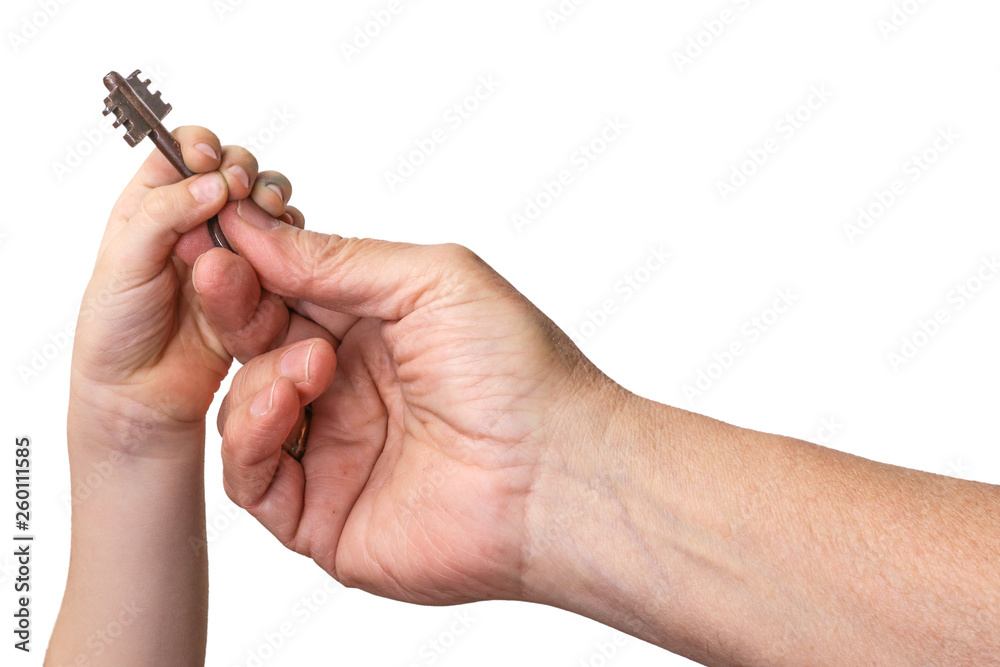 Old man gives key to child. Aged man`s and child's hands isolated on white. Old man gives key to child. Aged man`s and child's hands isolated on white.