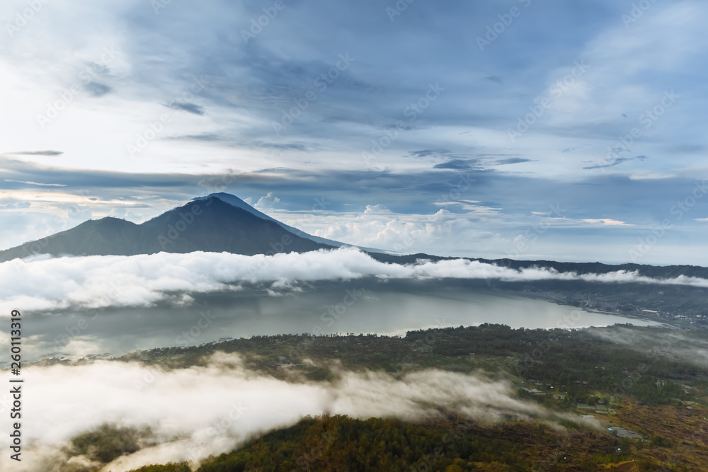 Active Indonesian volcano Batur in the tropical island Bali. Indonesia. Batur volcano sunrise serenity. Dawn sky at morning in mountain. Serenity of mountain landscape, travel concept