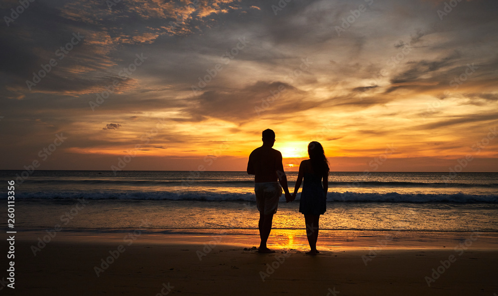 Happy couple watching the sunset. honeymoon thailand
