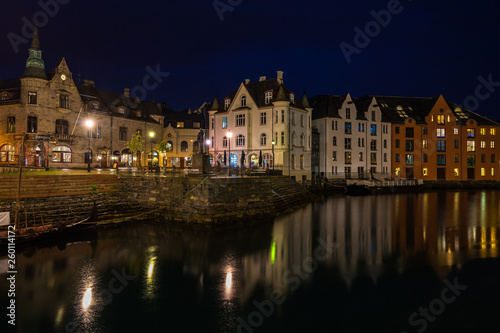 Scenic night view of Alesund Art Nouveau buildings along the inner harbour  Brosundet canal   Norway