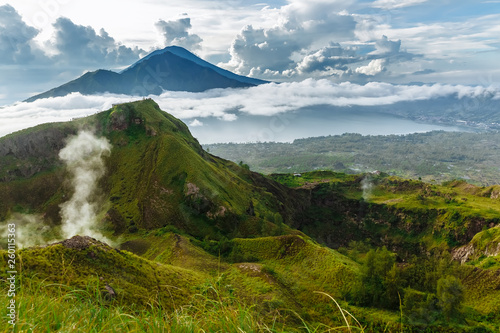 Active Indonesian volcano Batur in the tropical island Bali. Indonesia. Batur volcano sunrise serenity. Dawn sky at morning in mountain. Serenity of mountain landscape, travel concept photo