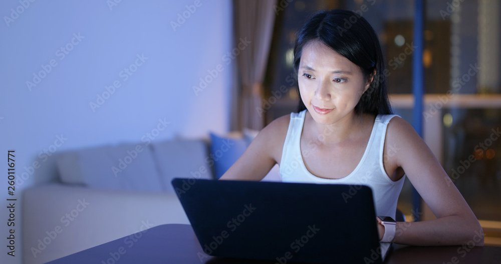 Woman study on laptop computer at home in the evening Woman study on laptop computer at home in the evening