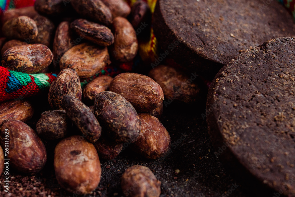 Cocoa and mexican chocolate close-up, extracted manually from the cacao beans or cacao nibs in Oaxaca Cocoa and mexican chocolate close-up, extracted manually from the cacao beans or cacao nibs in Oaxaca