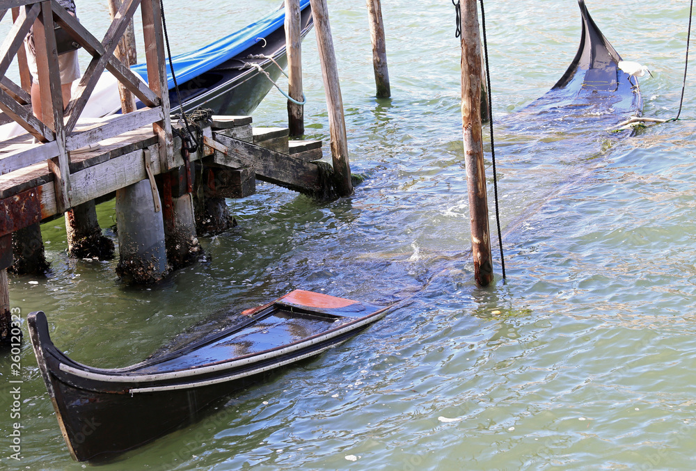 sunken wreck of a gondola in Venice