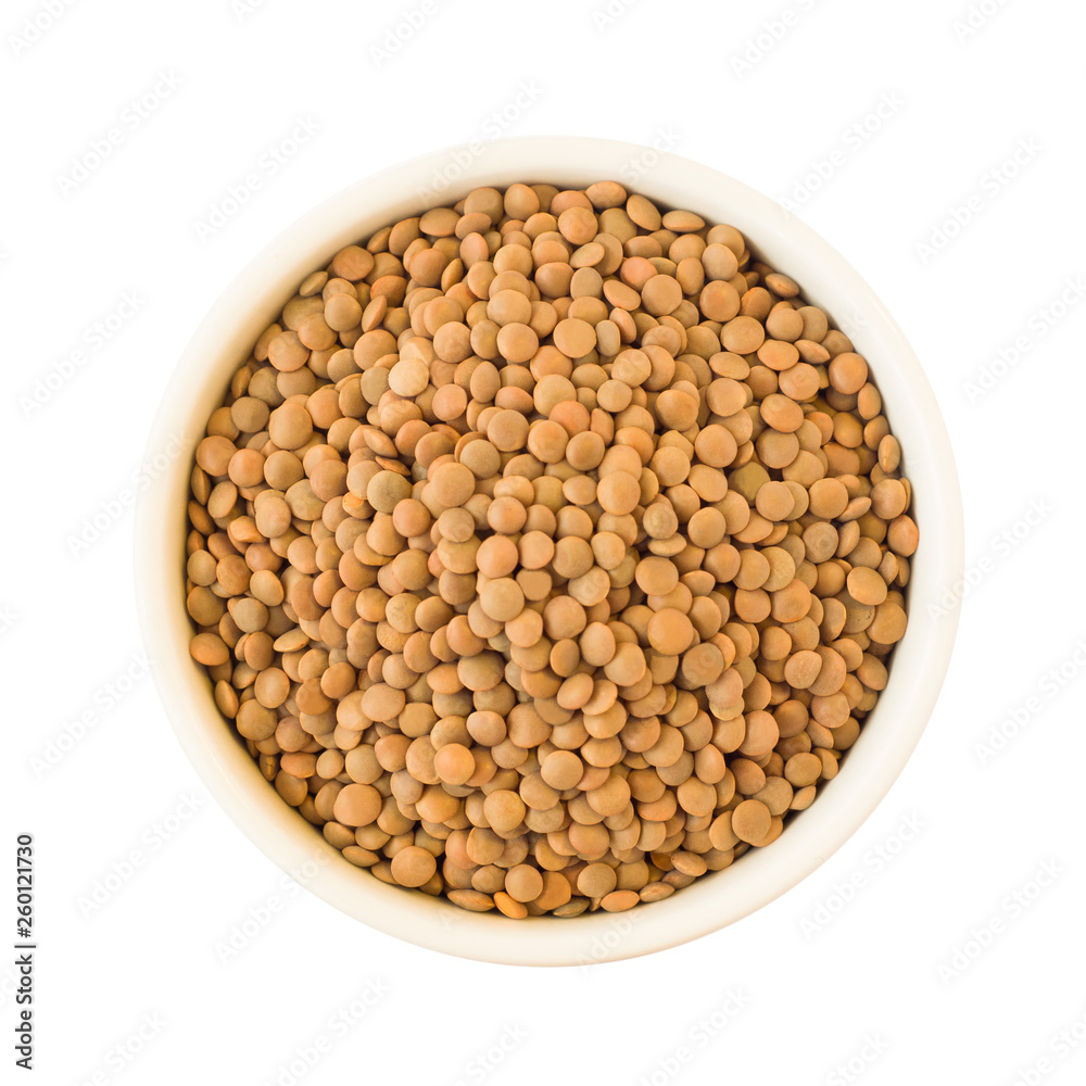 Top view of raw lentils seeds in round ceramic plate isolated on white background Top view of raw lentils seeds in round ceramic plate isolated on white background