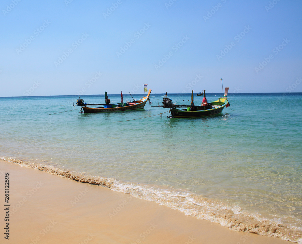 February 11, 2019. Karon beach, Thailand. Fishing boats at sea, near the shore. February 11, 2019. Karon beach, Thailand. Fishing boats at sea, near the shore.