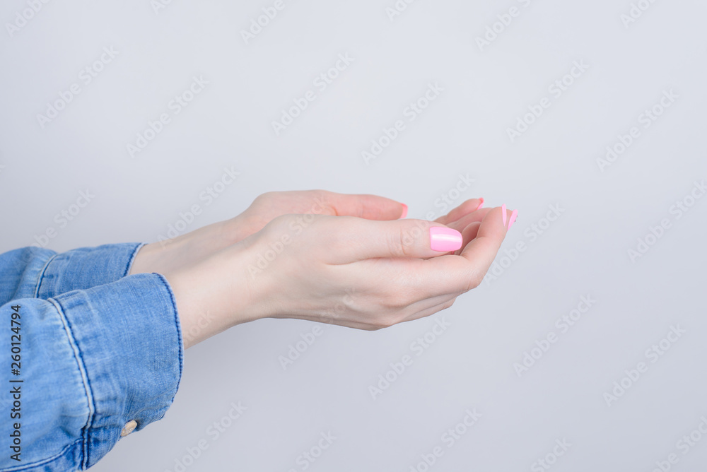 Side profile closeup cropped photo of cupped hands asking for forgivennes isolated grey background