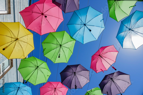 Colorful umbrellas hanging in the famous Orange Street Alley photo